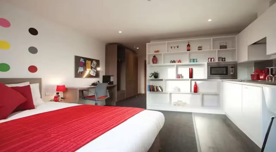 Bed desk shelves microwave kitchen studio apartment at Gallery Apartments in Glasgow Student Accommodation