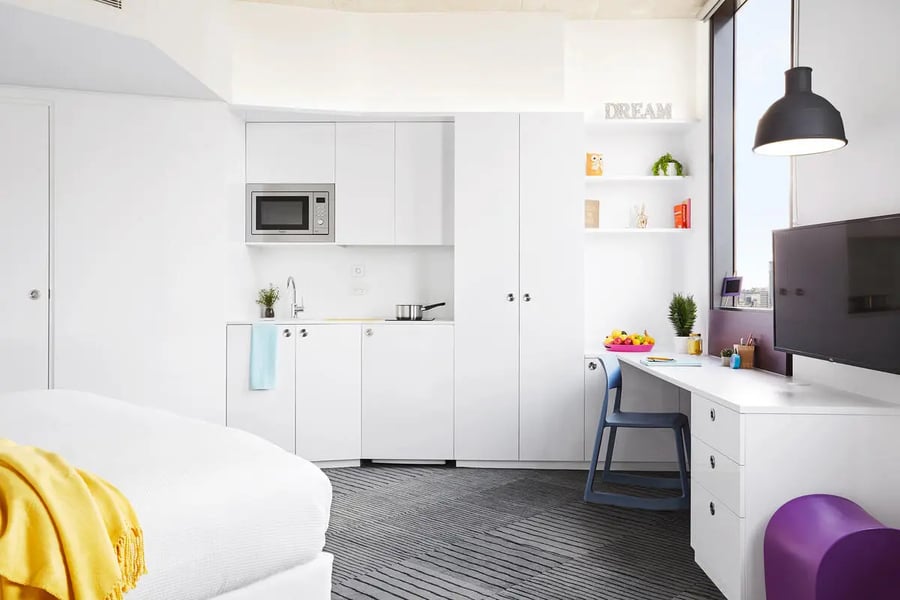 Kitchenette desk bed and television room at Scape South Bank in Brisbane Student Accommodation