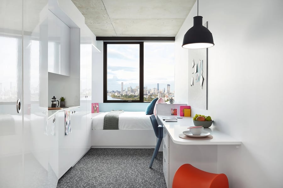 White cabinets bed desk with city view bedroom at Scape Toowong in Brisbane Student Accommodation