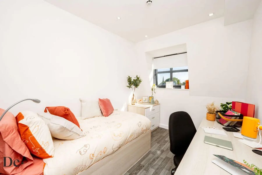 Bed pillows desk lamp and chair Bedroom at Castle Hill in Cambridge Student Accommodation
