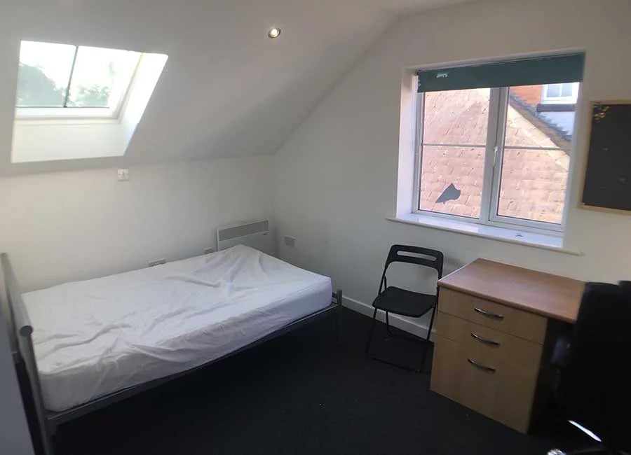 Bed desk chair and radiator bedroom at Radmoor House in Loughborough Student Accommodation