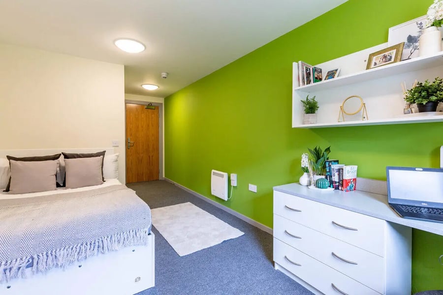 Bed, door, desk, shelves, laptop bedroom at Turner Court in Newcastle Upon Tyne Student Accommodation