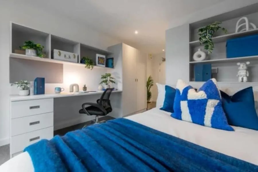 Desk chair bed and shelves bedroom at Infinity Coventry in Coventry Student Accommodation