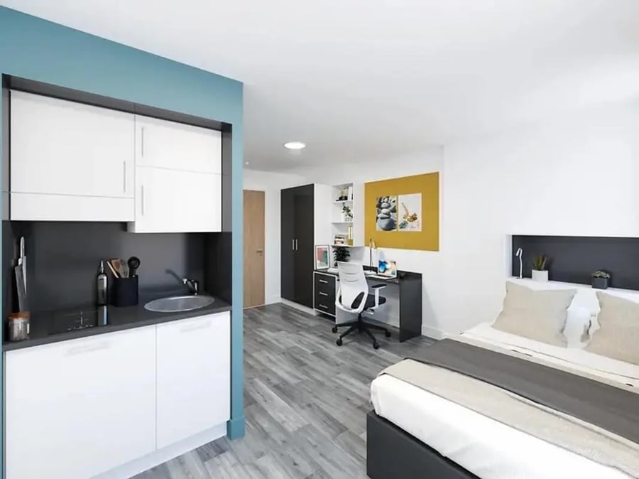 Compact kitchen desk chair and bed living room at Depot Point in London Student Accommodation