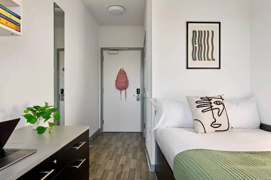 Bed desk mirror door backpack artwork bedroom at The Maltings in Colchester Student Accommodation