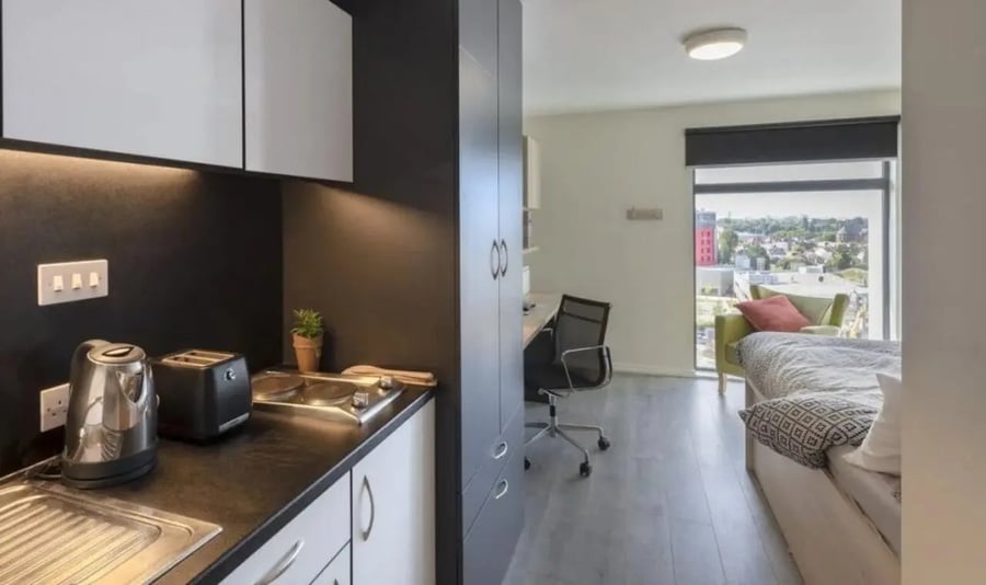 Kitchen kettle toaster bed desk chair bedroom at The Lyra in London Student Accommodation