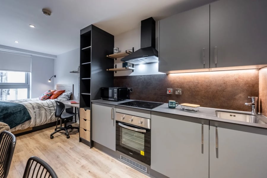 Bed desk chair and kitchen area studio apartment at Murieston Crescent - Edinburgh in Edinburgh Student Accommodation