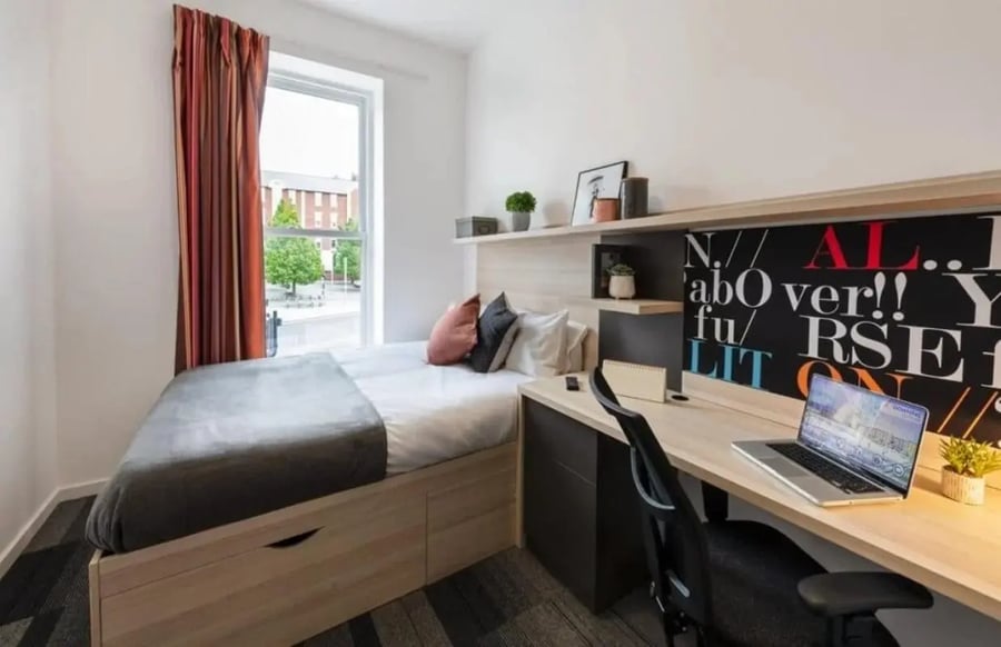 Bed desk laptop and wall art bedroom at The Arch - Liverpool in Liverpool Student Accommodation