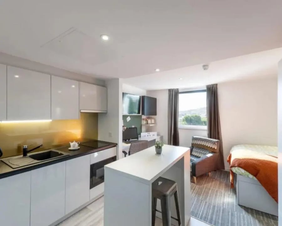 Modern studio apartment with kitchen and bed at New Park in Edinburgh Student Accommodation