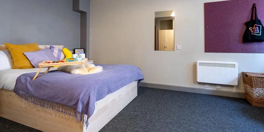 Bed with tray and pillows bedroom at The Heights in Birmingham Student Accommodation