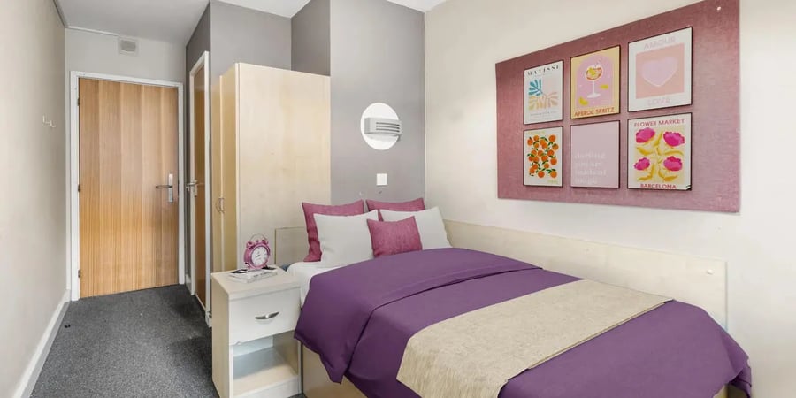 Bed dresser posters door wardrobe bedroom at The Heights in Birmingham Student Accommodation