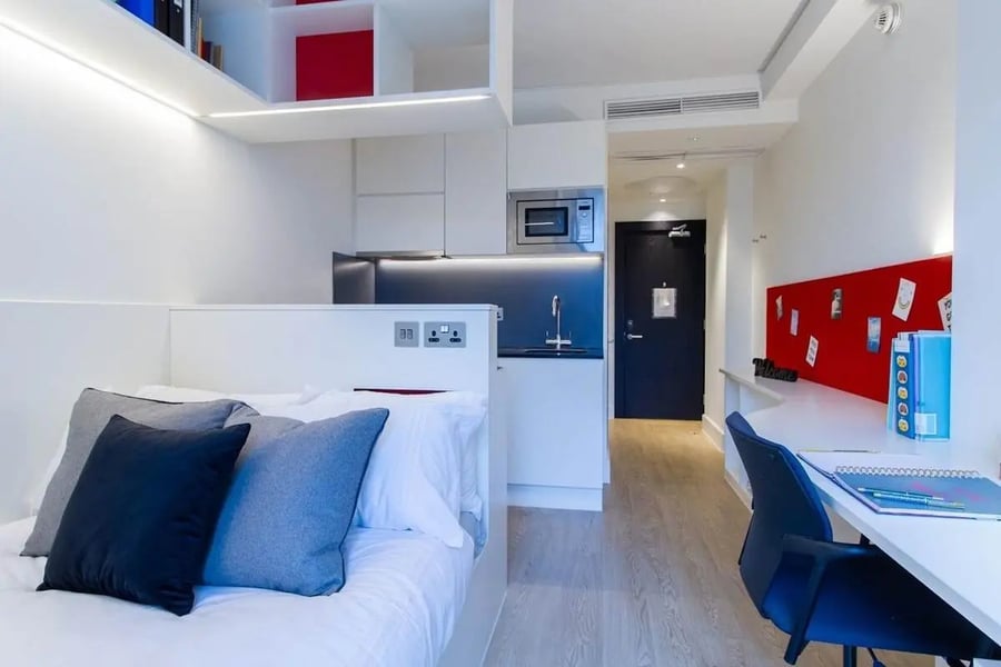 Bed kitchen desk and chair studio apartment at Spring Mews in London Student Accommodation