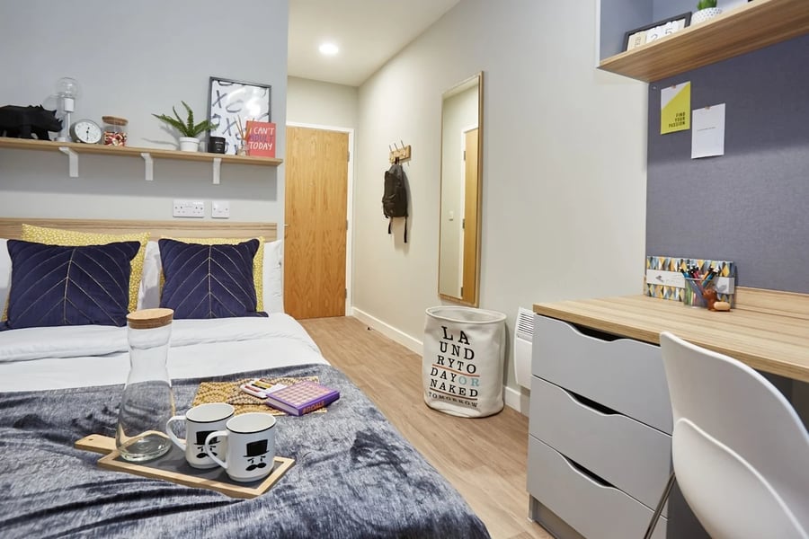Bed desk and laundry basket bedroom at Gulson Gardens in Coventry Student Accommodation
