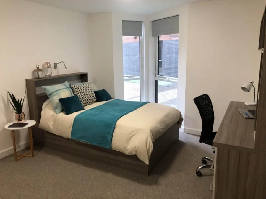 Bed with desk and chair bedroom at Q Studios in Stoke-On-Trent Student Accommodation