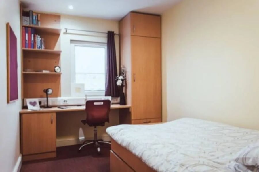 Bookshelf desk chair closet bed bedroom at Longside House Bradford in Bradford Student Accommodation