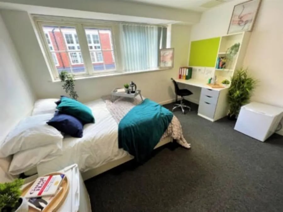 Bed desk and fridge bedroom at Tudor Studios in Leicester Student Accommodation