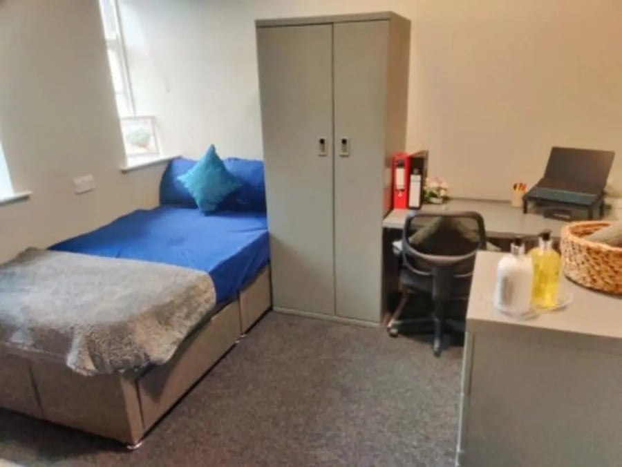 Bed wardrobe desk chair laptop student accommodation bedroom at St Mary's Newcastle in Newcastle Upon Tyne Student Accommodation