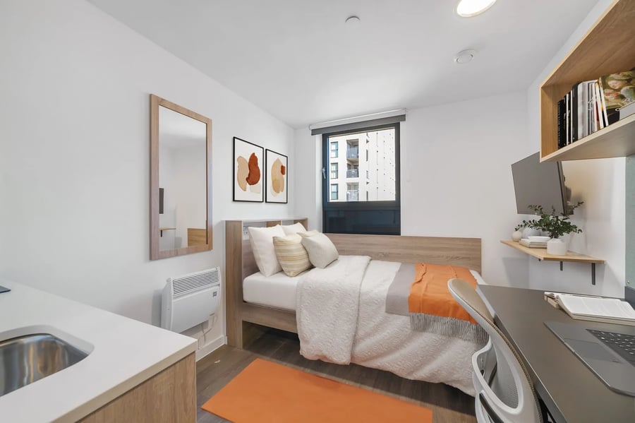 Bed desk mirror sink and heater bedroom at Canvas Walthamstow in London Student Accommodation