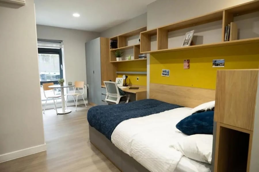 Bed desk chairs shelves and table bedroom at Panmure Court in Edinburgh Student Accommodation