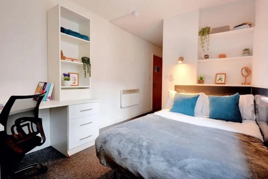 Desk chair shelves and bed bedroom at Newarke Street Leicester in Leicester Student Accommodation