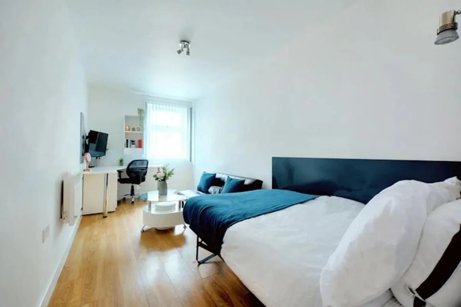 Bed desk sofa and coffee table bedroom at Newarke Street Leicester in Leicester Student Accommodation