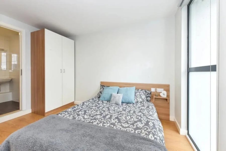 Bed wardrobe pillows window bedroom at The Summit Leicester in Leicester Student Accommodation