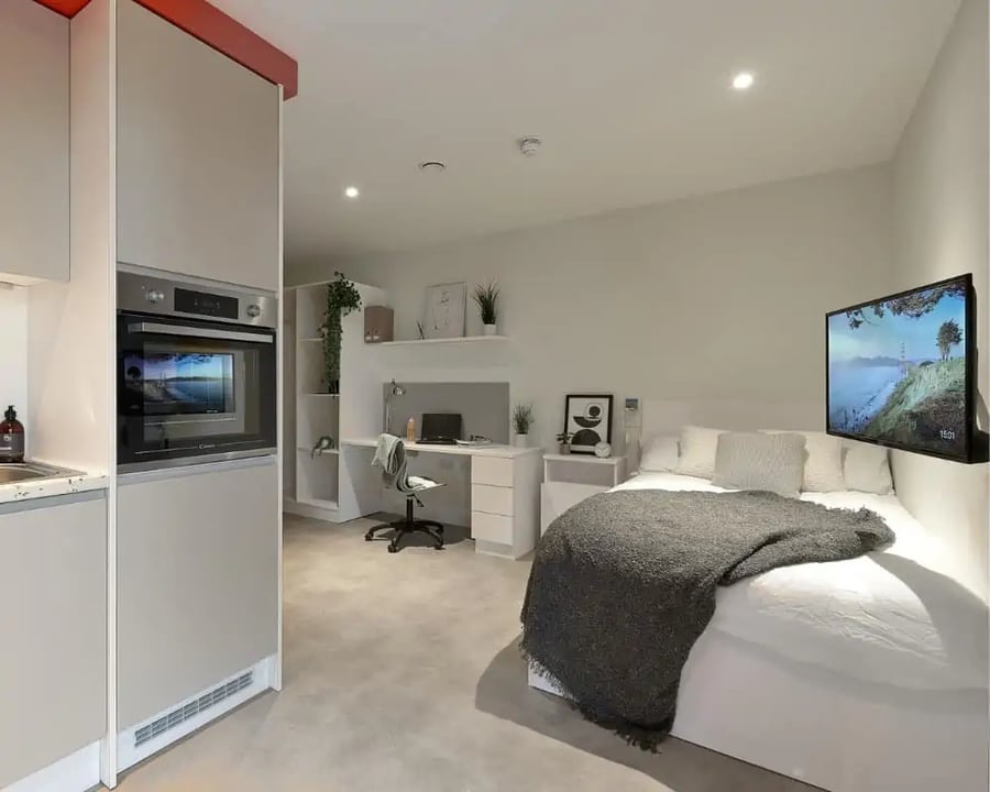 Kitchen oven study desk and bed bedroom at Host View Studios in London Student Accommodation