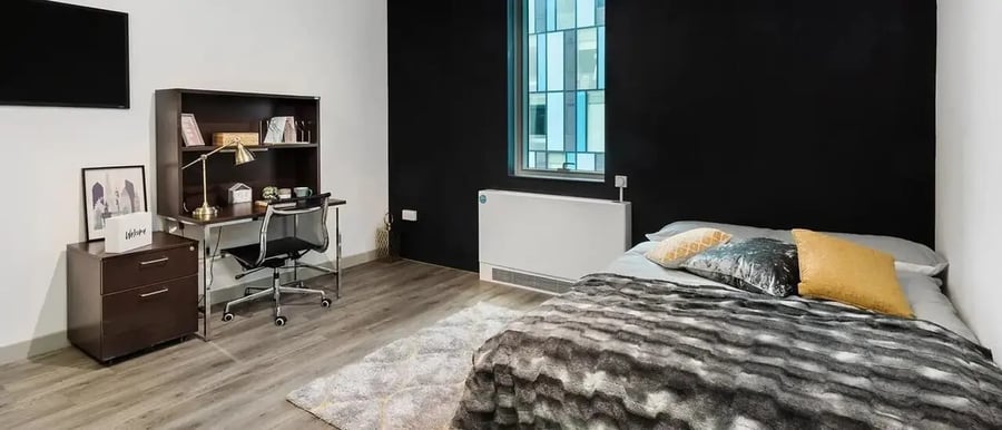 Bed desk dresser and TV bedroom at Chapter Kings Cross in London Student Accommodation