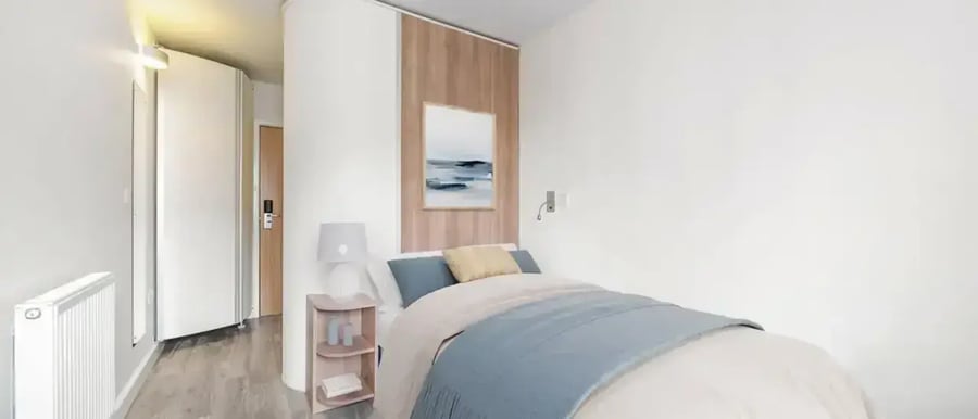 Bed radiator lamp painting and door bedroom at Chapter Highbury in London Student Accommodation