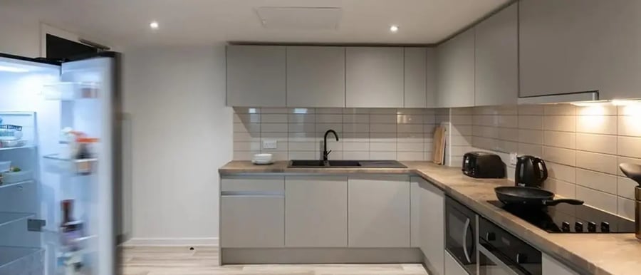Open refrigerator sink and appliances kitchen at Chapter Ealing in London Student Accommodation