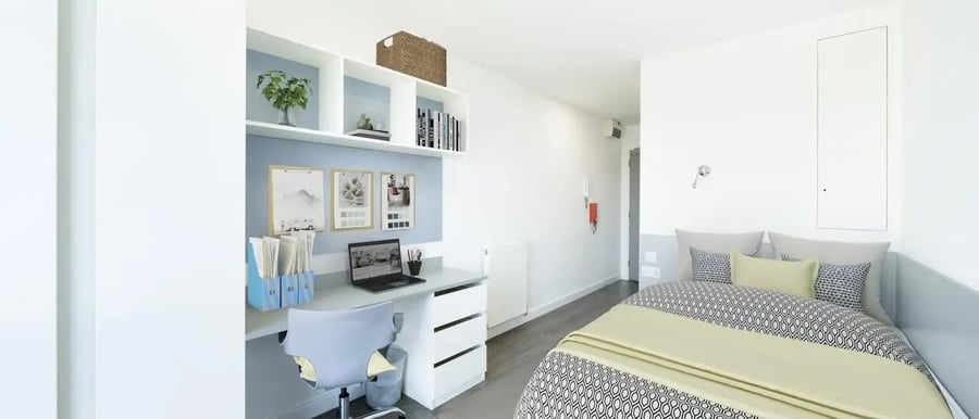 Desk laptop chair shelves and bed bedroom at Chapter Lewisham in London Student Accommodation