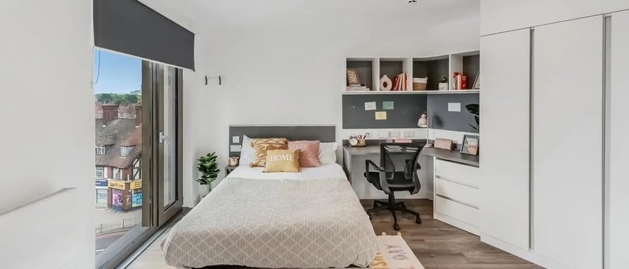 Bed desk chair shelves and wardrobe bedroom at Chapter White City in London Student Accommodation