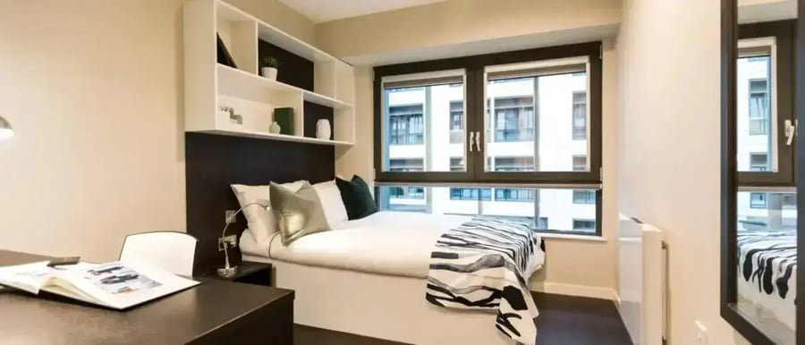 Bed desk shelves and window bedroom at Chapter Old Street in London Student Accommodation