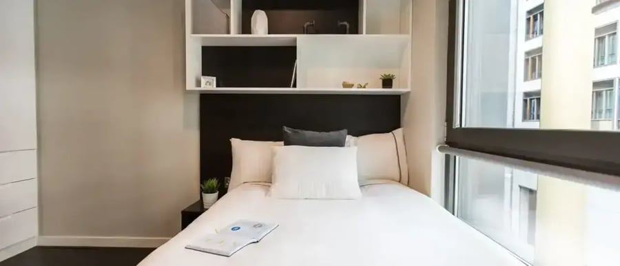 Bed shelves and window bedroom interior. at Chapter Old Street in London Student Accommodation