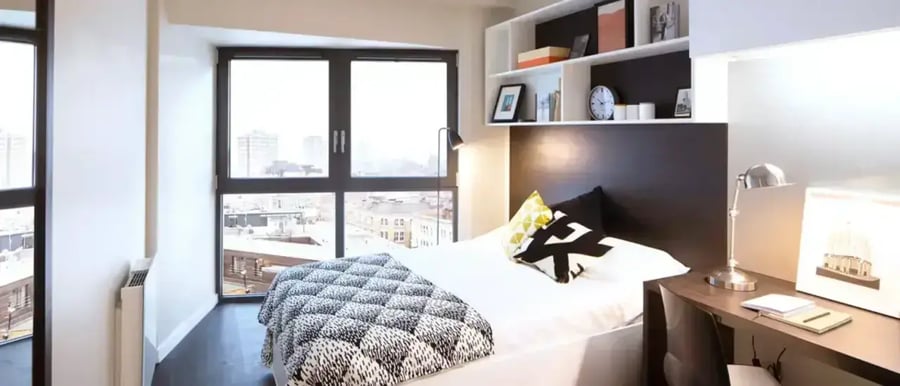 Bed desk shelves and lamp bedroom at Chapter Old Street in London Student Accommodation