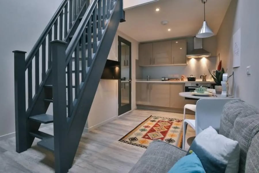 Stairs kitchen table sofa living area at Dean Clarke Lofts in Exeter Student Accommodation