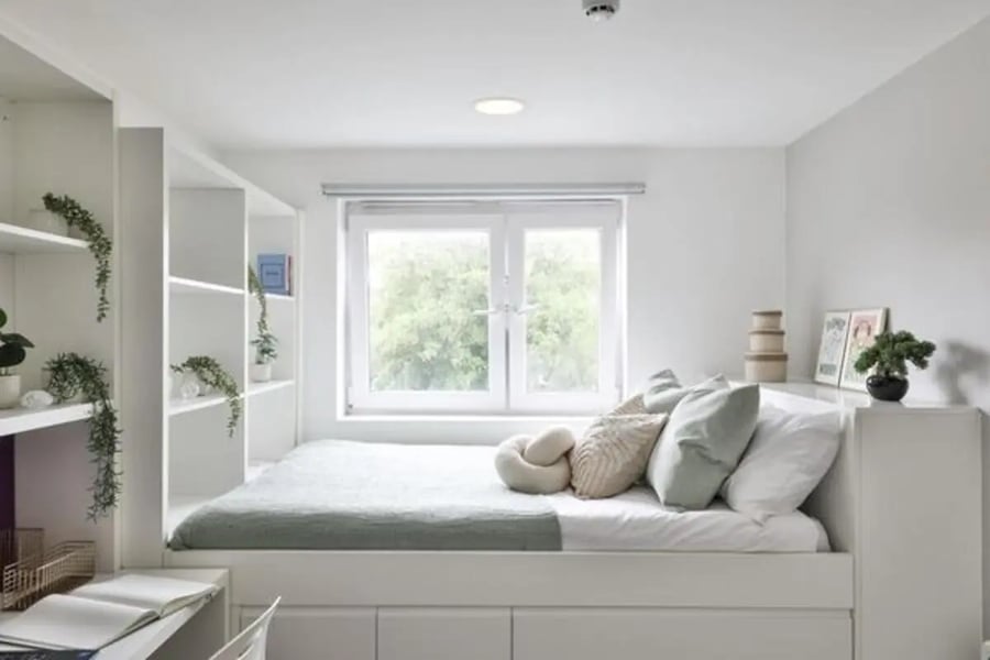 Bed with pillows shelves and desk bedroom at Kingsmill Studios in Huddersfield Student Accommodation