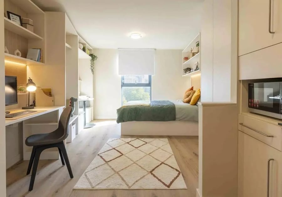 Desk bed rug microwave kitchenette bedroom at iQ Bristol in Bristol Student Accommodation