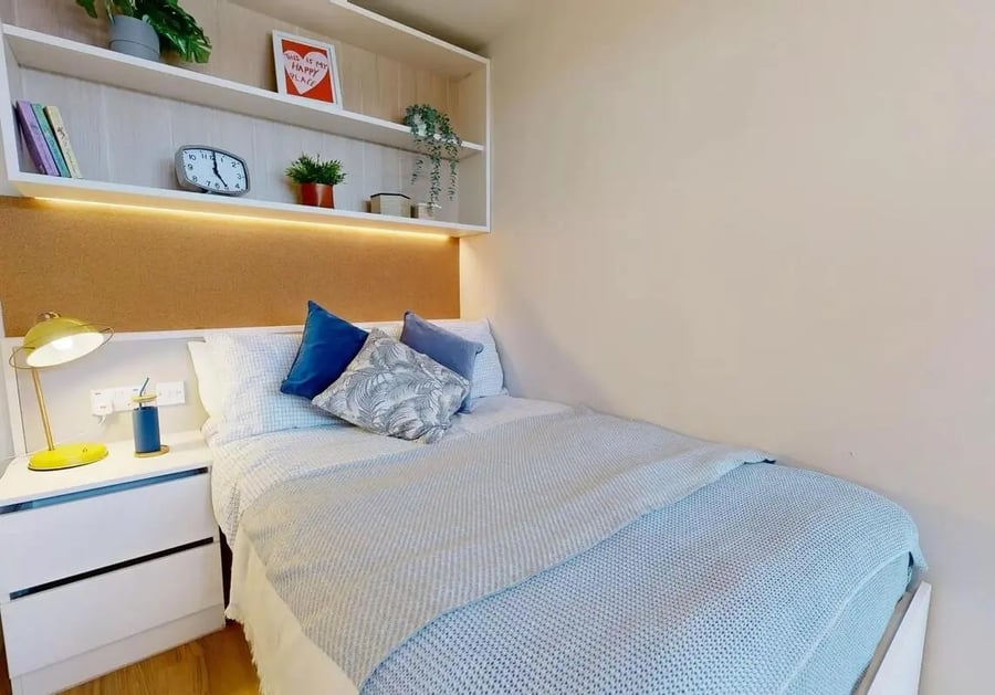 Bed with pillows and lamp bedroom at iQ Bristol in Bristol Student Accommodation