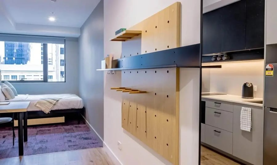 Bed study desk and kitchen area at The Switch Melbourne Victoria Market in Melbourne Student Accommodation