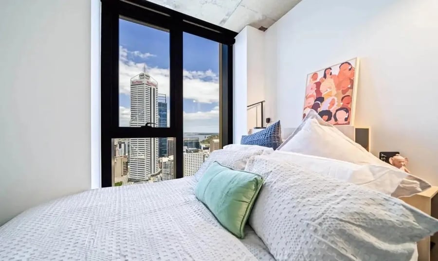 Bed pillows artwork cityscape view bedroom at Perth Central in Perth Student Accommodation