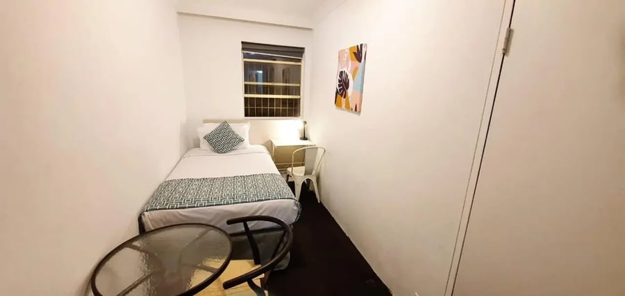 Single bed desk chair and table bedroom at ume Redfern Village in Sydney Student Accommodation