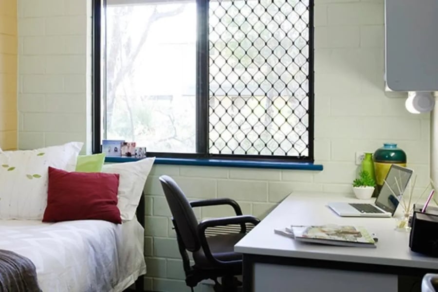 Bed desk chair laptop and vase bedroom at ECU Villlage Mount Lawley in Perth Student Accommodation
