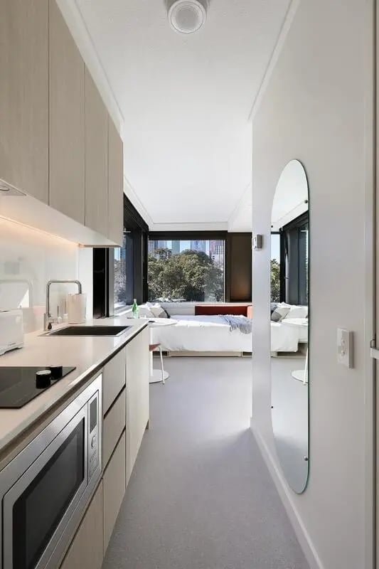 Kitchen with microwave bed and mirror bedroom at Iglu Flagstaff Gardens in Melbourne Student Accommodation