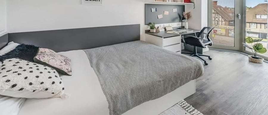 Bed desk chair plant bedroom at Chapter White City in London Student Accommodation