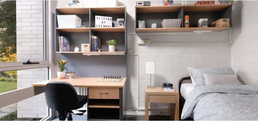 Desk chair bed shelves and window student bedroom at La Trobe University - Menzies College in Melbourne Student Accommodation