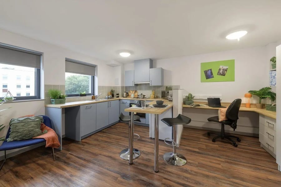 Modern kitchen with breakfast bar and desk area kitchen at Bryson Court in Newcastle Upon Tyne Student Accommodation