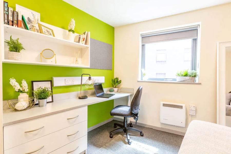 Desk with laptop chair and shelving study area at Bryson Court in Newcastle Upon Tyne Student Accommodation