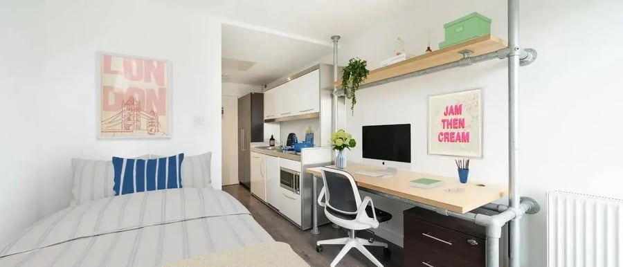 Bed kitchen desk and computer studio apartment at Chapter Spitalfields in London Student Accommodation