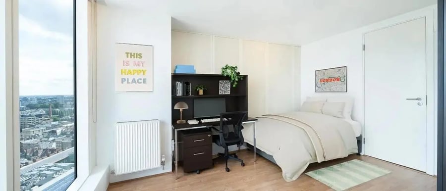 Desk bed radiator artwork and window bedroom at Chapter Spitalfields in London Student Accommodation